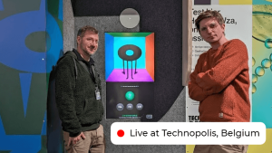 dennis and dries next to ai clerk in technopolis. We see wowza in the middle.