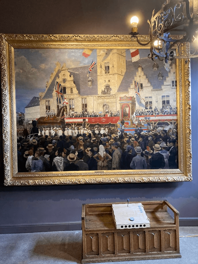The Verhas painting on the wall with the white talking console on a wooden bench below it