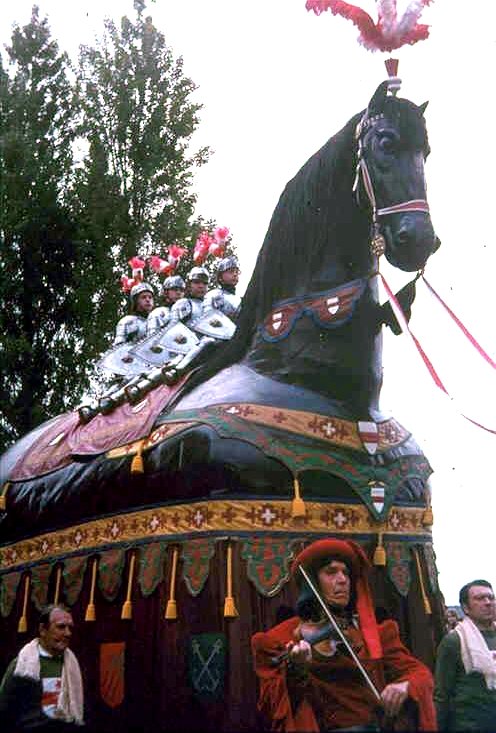 The Ros Beiaard carried through the streets of Dendermonde during the 1975 ommegang, with the four Heemskinderen on its back