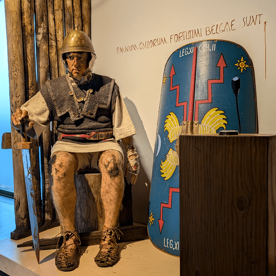 Quintus Barbius Velinus, the seated Roman legionary, front view in the Archeocentrum Velzeke